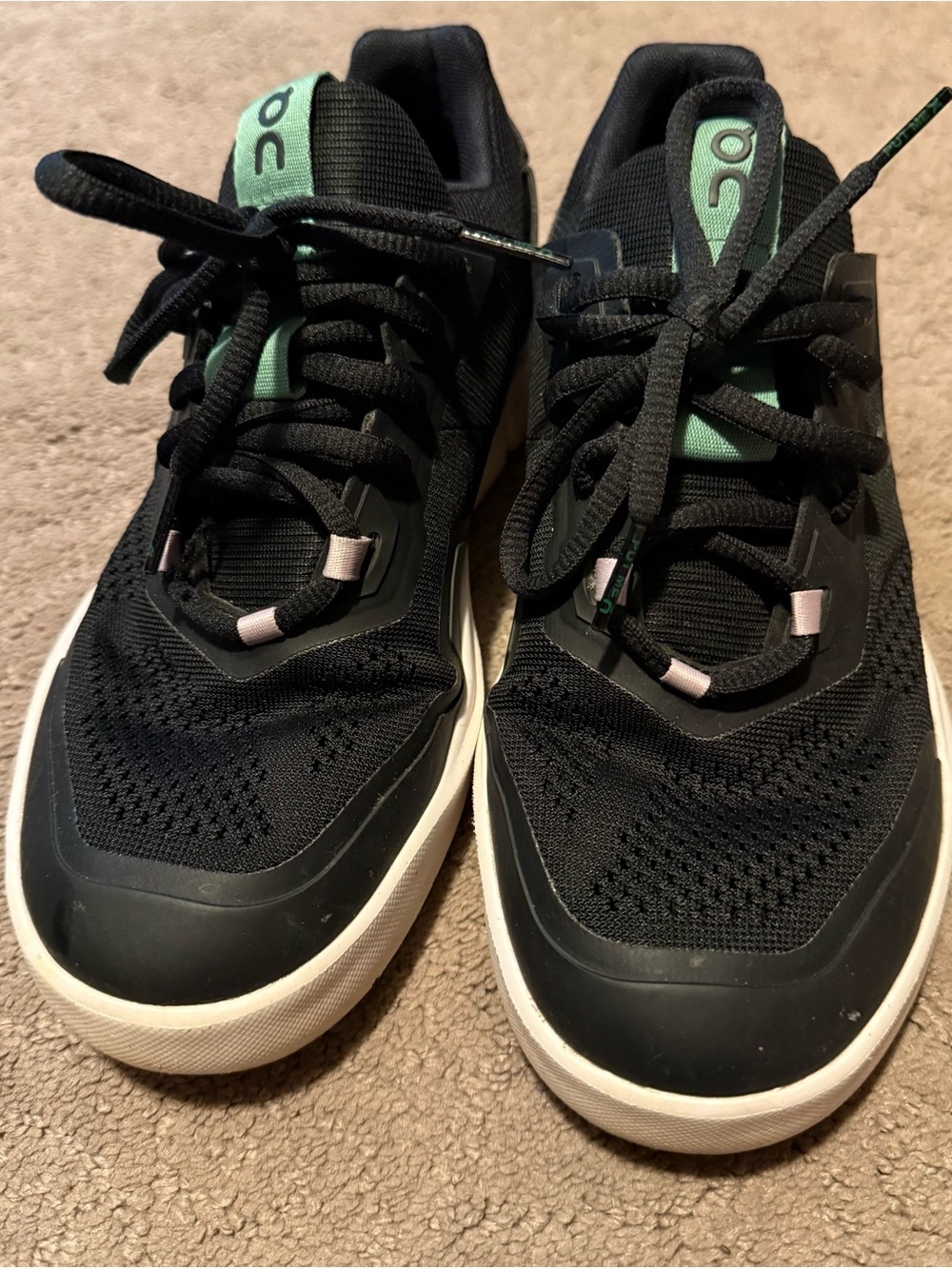 On Running The Roger Spin black sneakers with mint green detailing